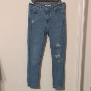 Levi Strauss 711 Skinny Women's Mid Rise Blue Distressed Jeans. Size 28
